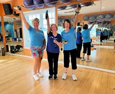 Three class participants having fun in our upstairs class space