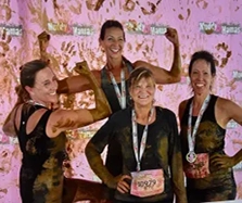 Fit friends having run at a recent "mud" event